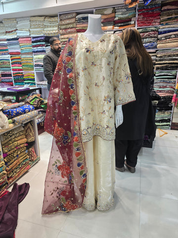 An elegant off white embroidered ensemble
